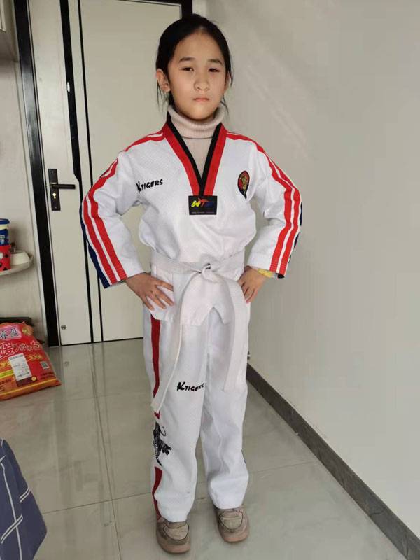 Taekwondo's tuxedo, first-school adult coach, and taekwondo's tattoo embroidery