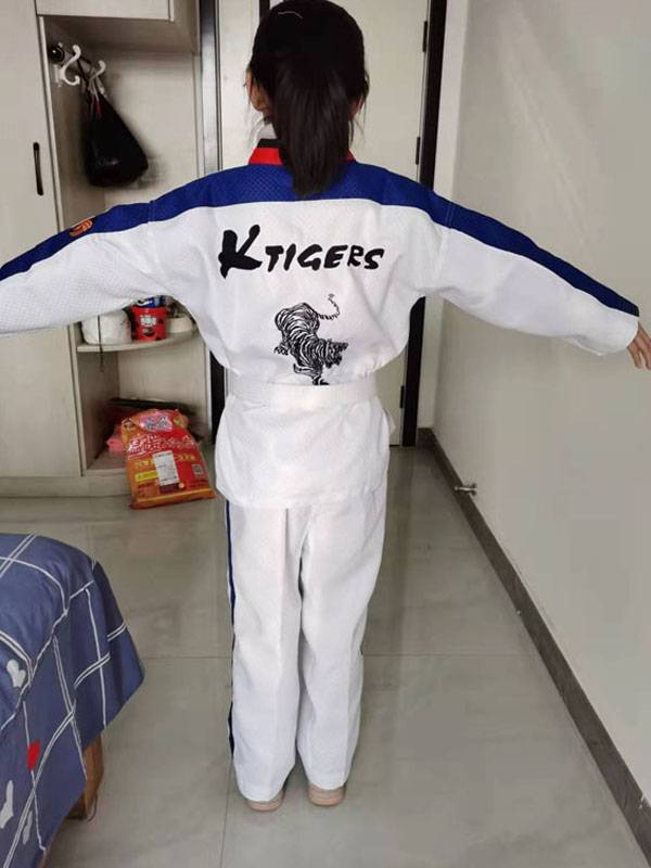 Taekwondo's tuxedo, first-school adult coach, and taekwondo's tattoo embroidery