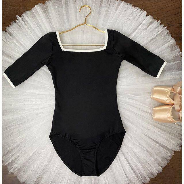 Jasmine opens up a dance dress for a ballerina