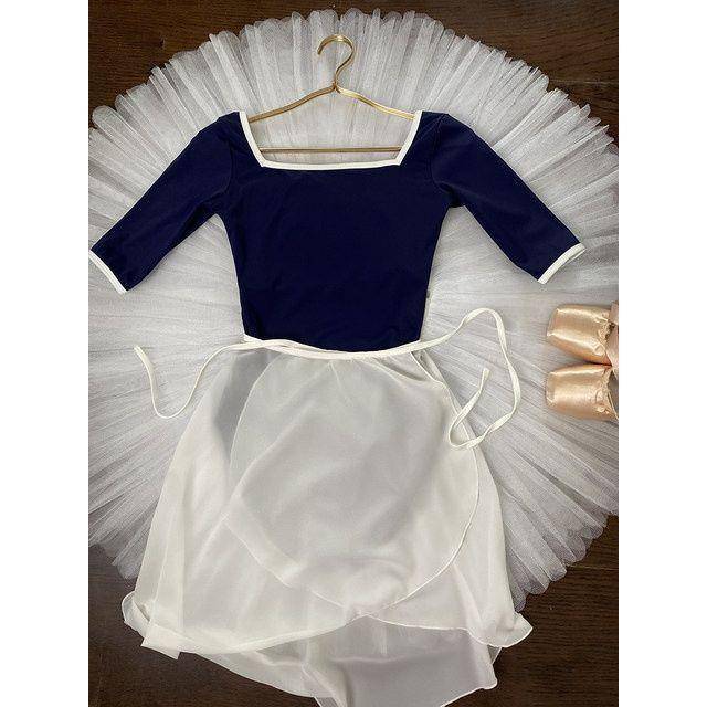 Jasmine opens up a dance dress for a ballerina