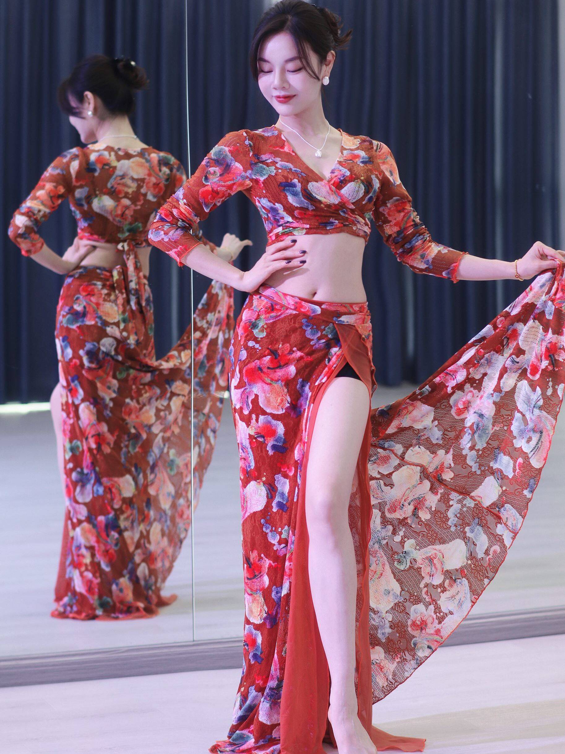 Mr. Zhang-Liu and a pumpkin-coloured lace dress in a belly dance