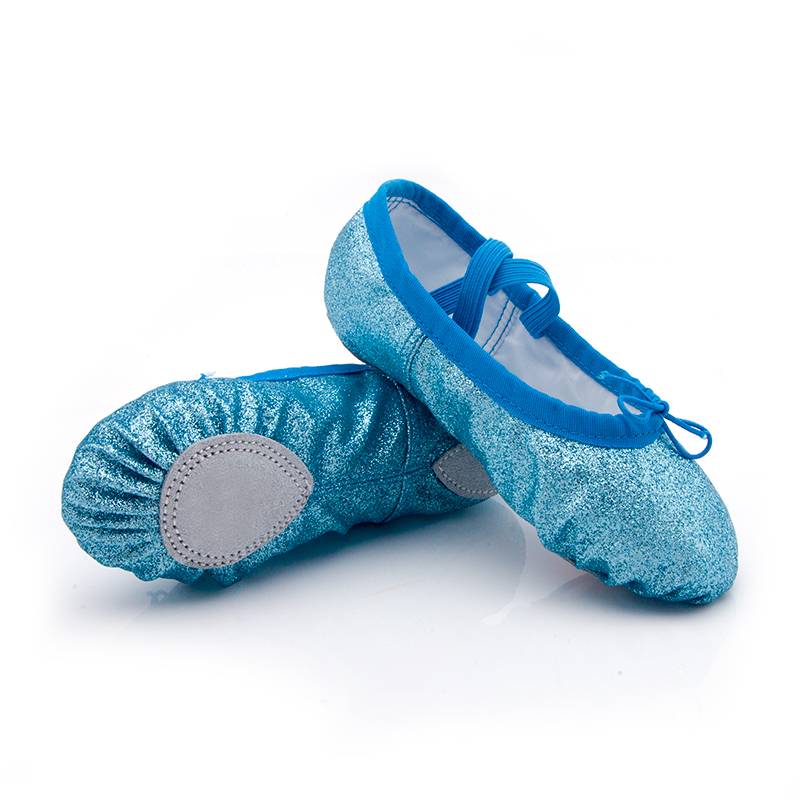 Gold-coloured dancing shoes, and a soft-shoeed, pedestaled, pedal-cup pedal girl, national tummy dance