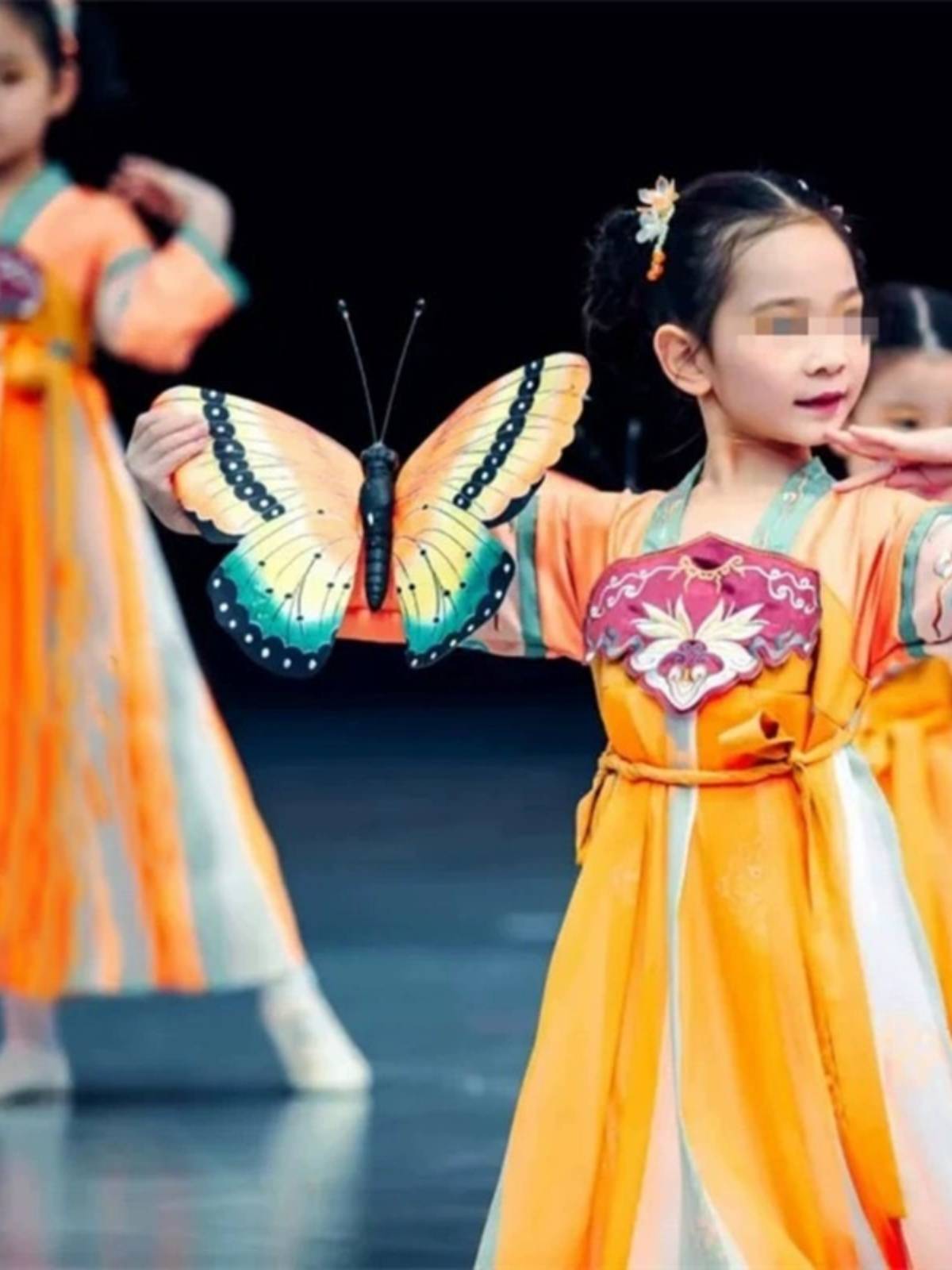 The same 6-1 children performing in the Intoxicated Windshow and the Classic Butterfly Dress