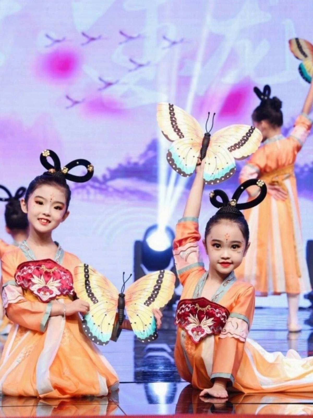 The same 6-1 children performing in the Intoxicated Windshow and the Classic Butterfly Dress