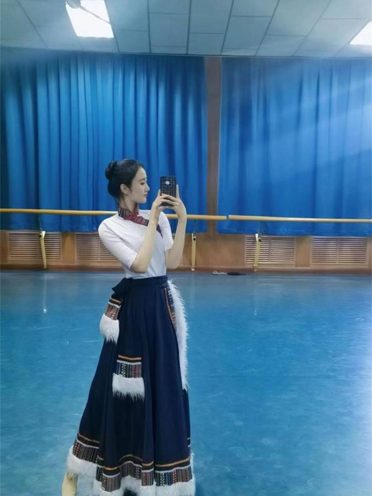 A Tibetan dance costume, a tuxedo, a kimono, and a kimono