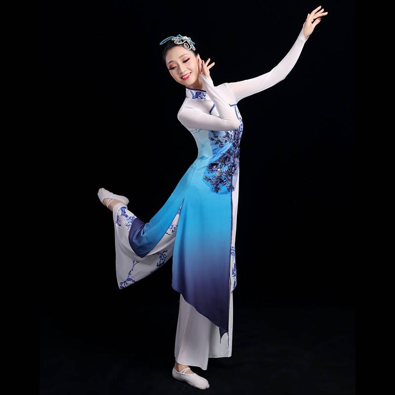 A grown man with a Chinese wind umbrella dance and a Chinese dance