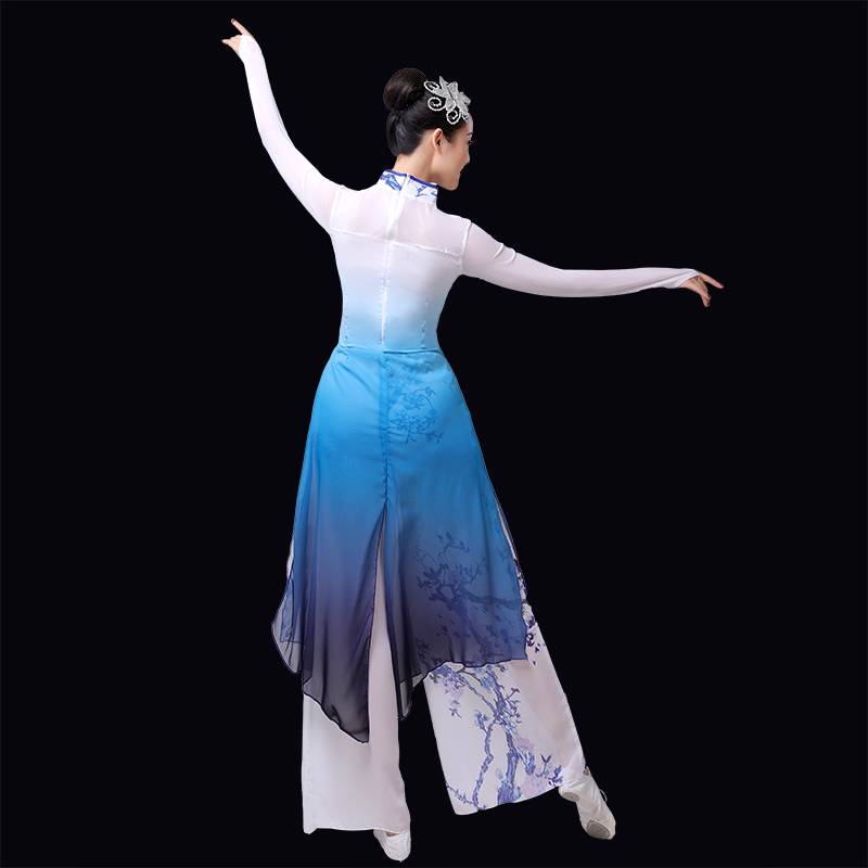 A grown man with a Chinese wind umbrella dance and a Chinese dance