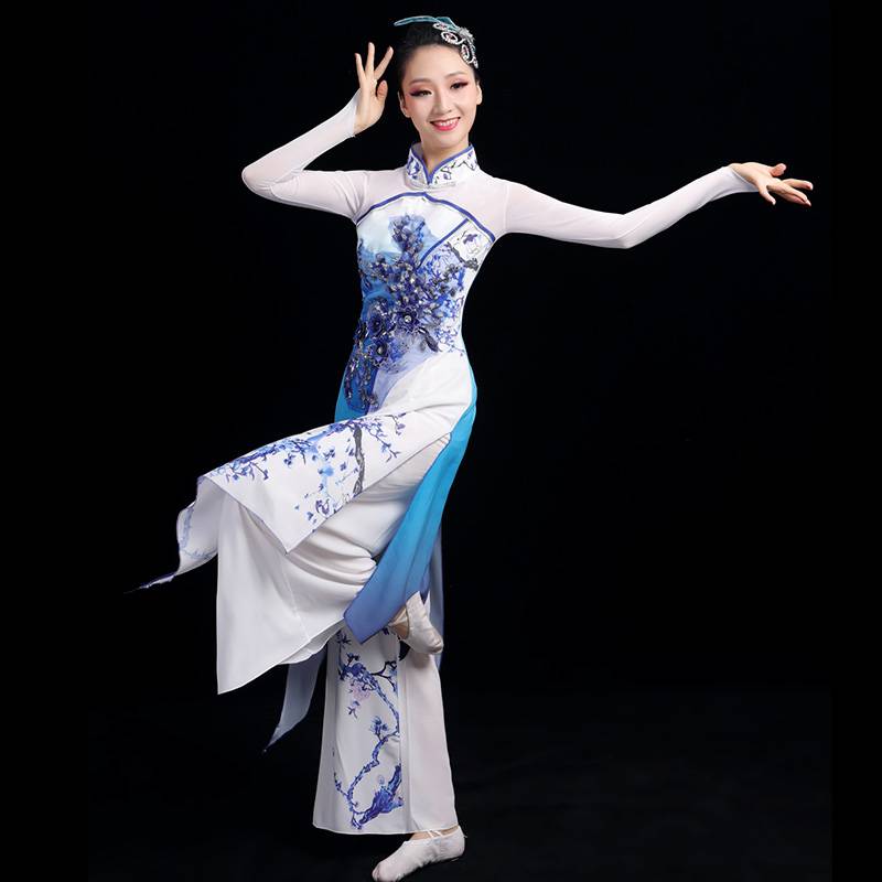 A grown man with a Chinese wind umbrella dance and a Chinese dance