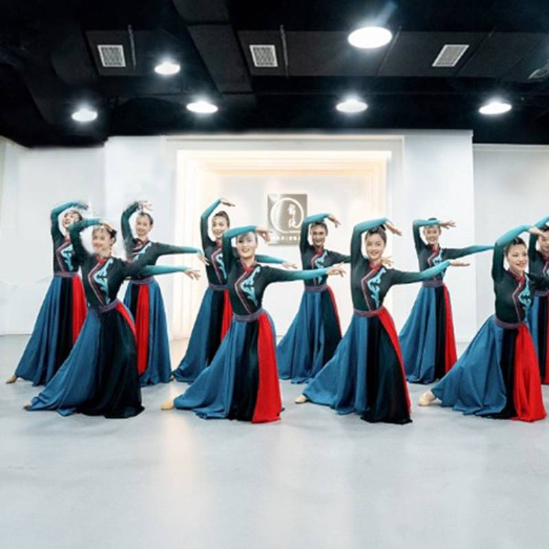 Mongols performing with a modern ethnic-minority costume, a charmong dance dress, a velvet suit