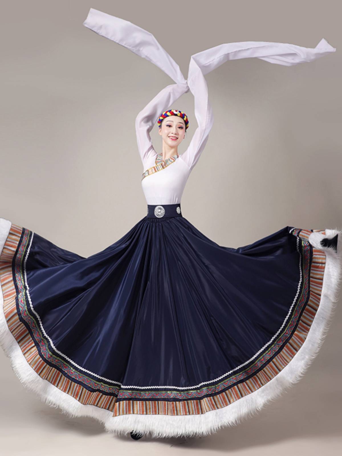 A Tibetan dance show with a Tibetan half-tied dress and a Tibetan dress