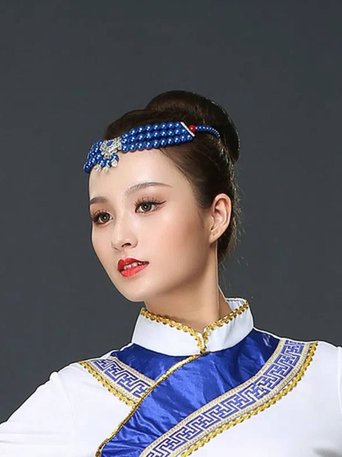 Mongol heads and a new collection of ethnic-minority dancers performing hand-chorus dance costumes