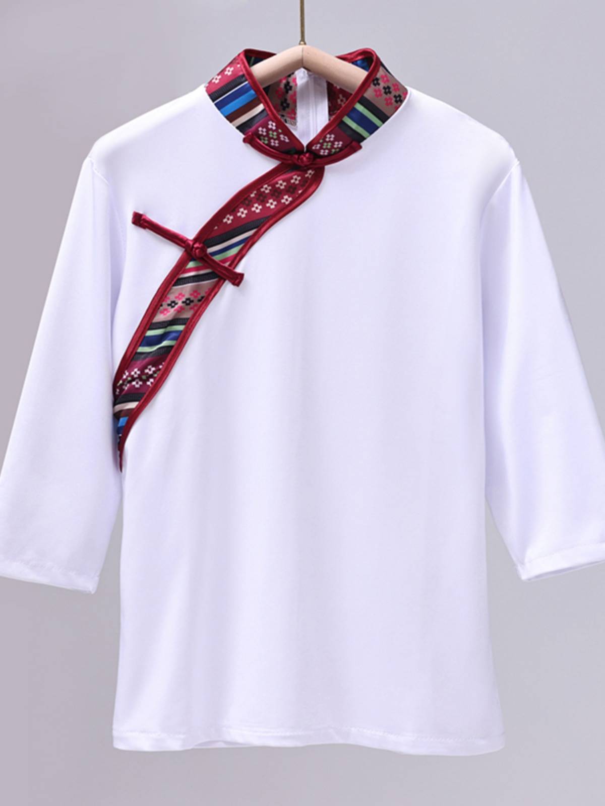 A Tibetan dance examination to practice milk silk shirts and new clothes for the adult minority to dance and perform their sleeves
