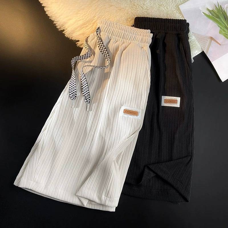 Mall counter large -name clearance leakage casual shorts men's summer ice silk loose sports five -point horse pants tide card