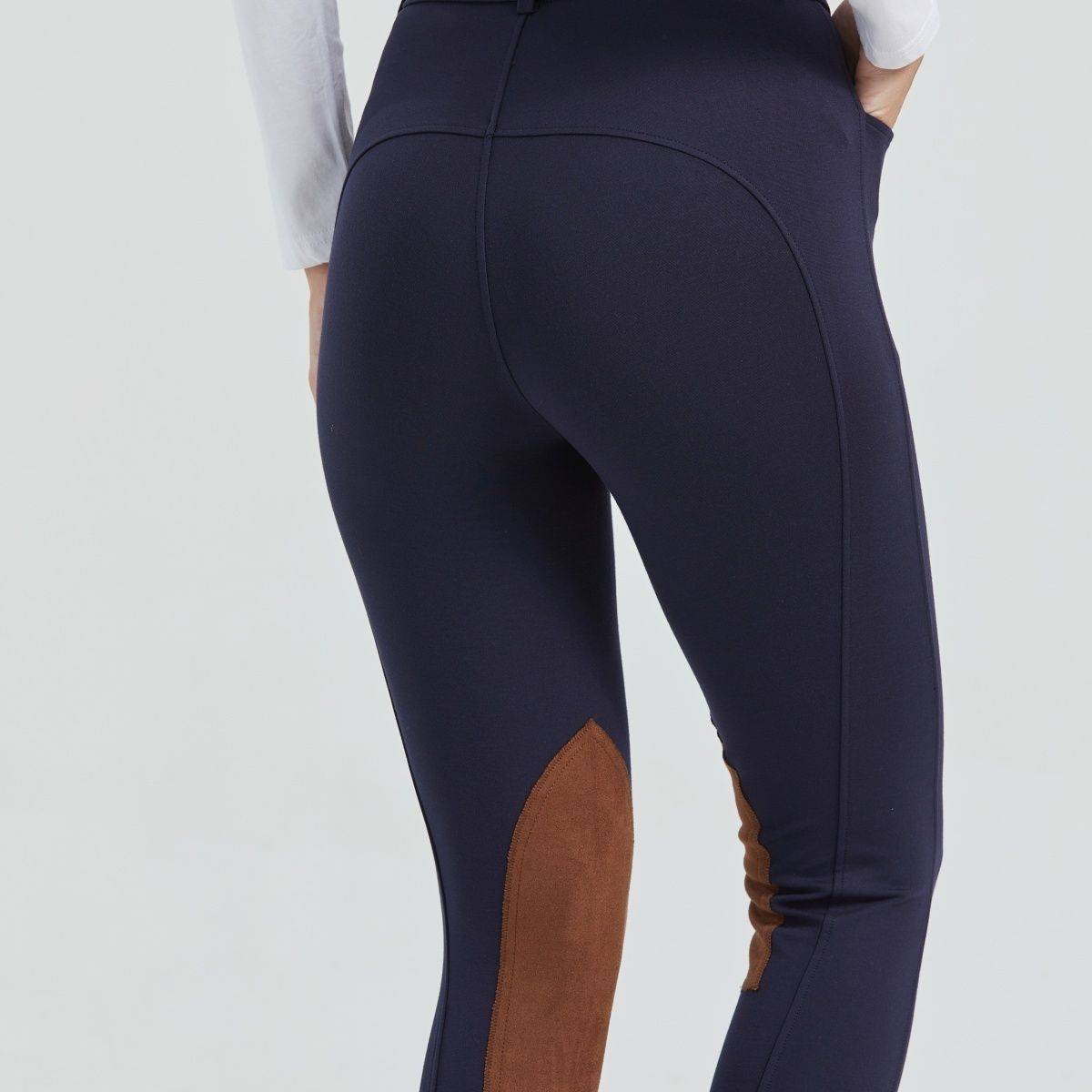 Half-skinned children in horse-suits and scooter-proof sports pants dry on horse-pants and summer-pants on horse-pants