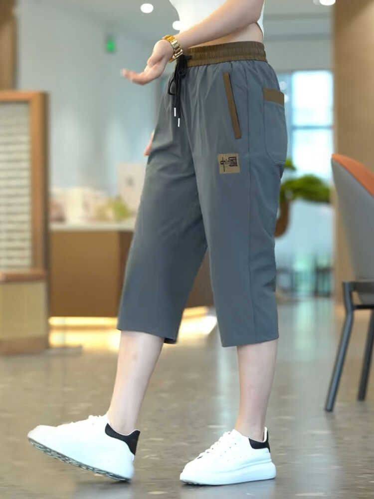 Ice silk seven -point pants men's summer thin loose and fast dry wearing middle pants men's pants sports casual shorts