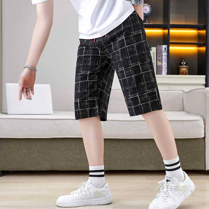 Summer men's cropped pants elastic shorts fashion casual slimming pants trend checkered grid horse pants pork pants men