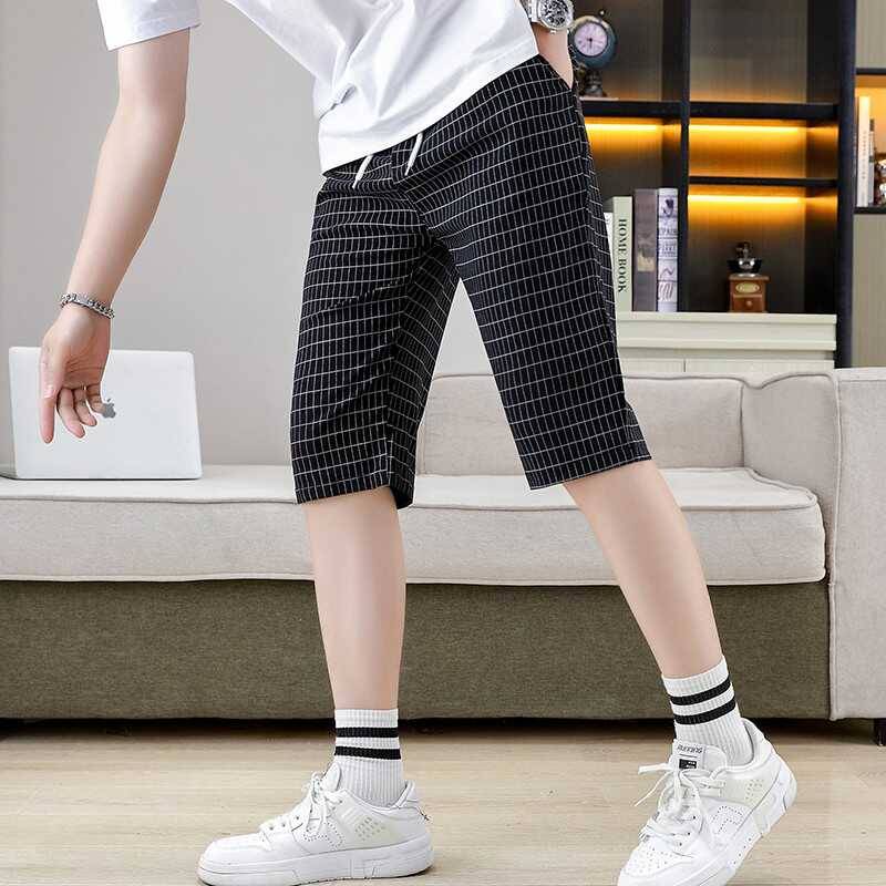 Summer men's cropped pants elastic shorts fashion casual slimming pants trend checkered grid horse pants pork pants men