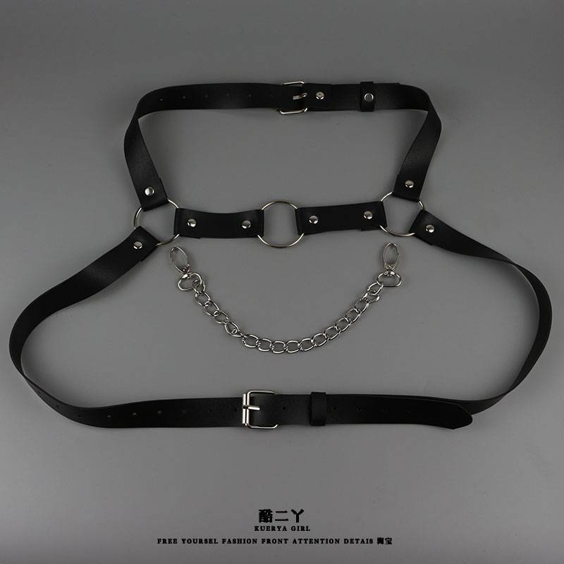 Cool, sexy guy with a laced neck and a punk corset on his shoulder with a bra and a belt on his back