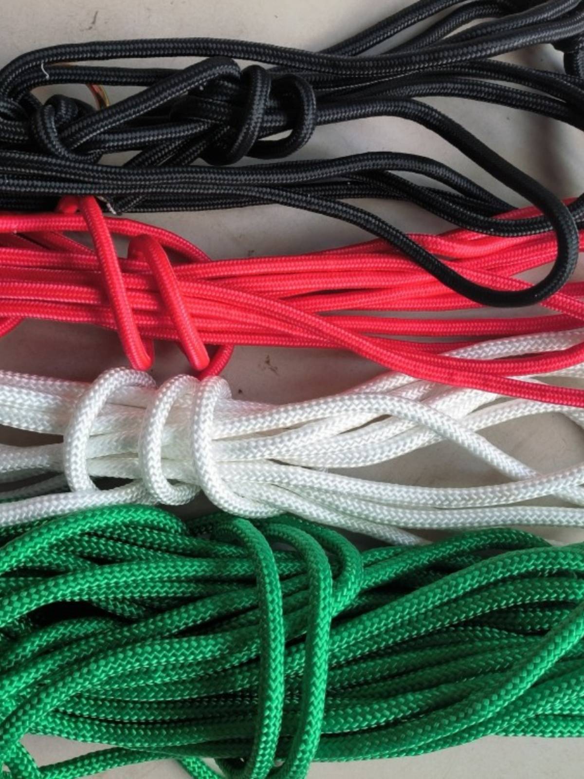 The rope used to tie the cow rope to make the rope red white black green rope brake rope bundle rope woven rope