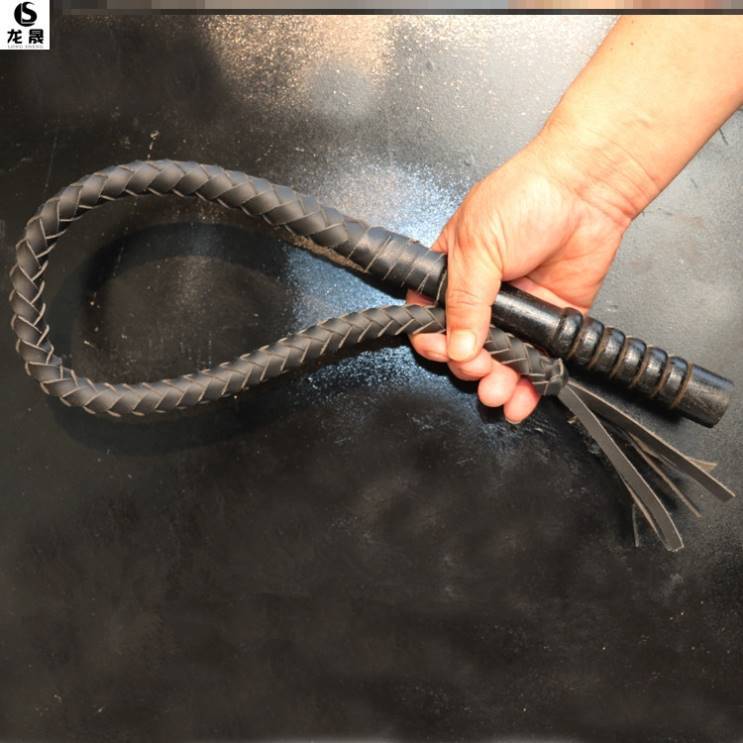 One metre of black, pure oxen lashes, wooden handle
