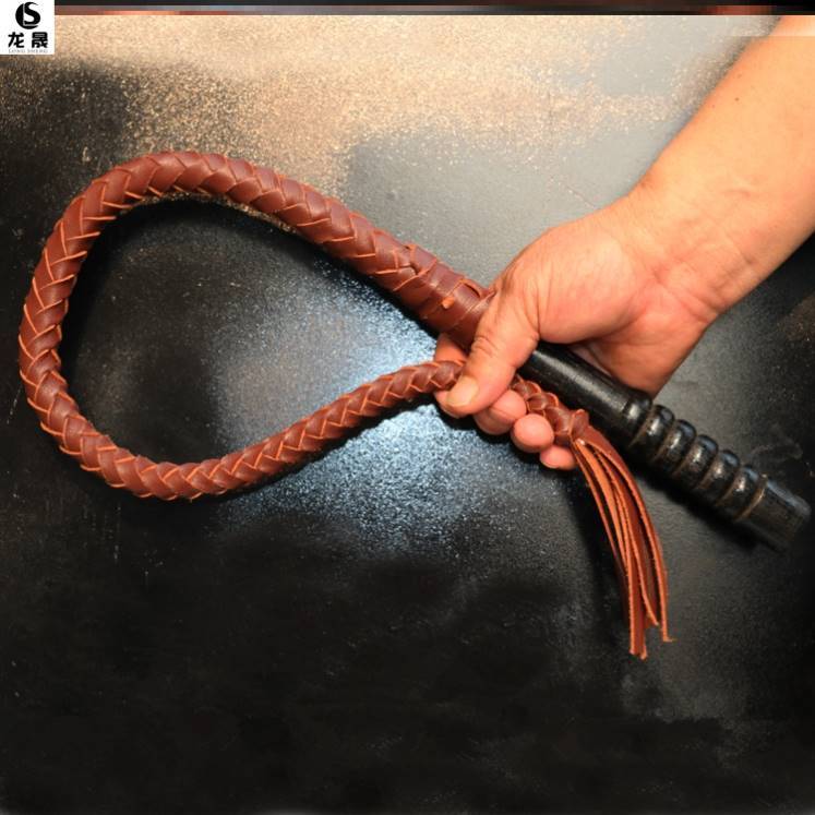 80 centimeters of brown, pure oxen-skin, wood handle
