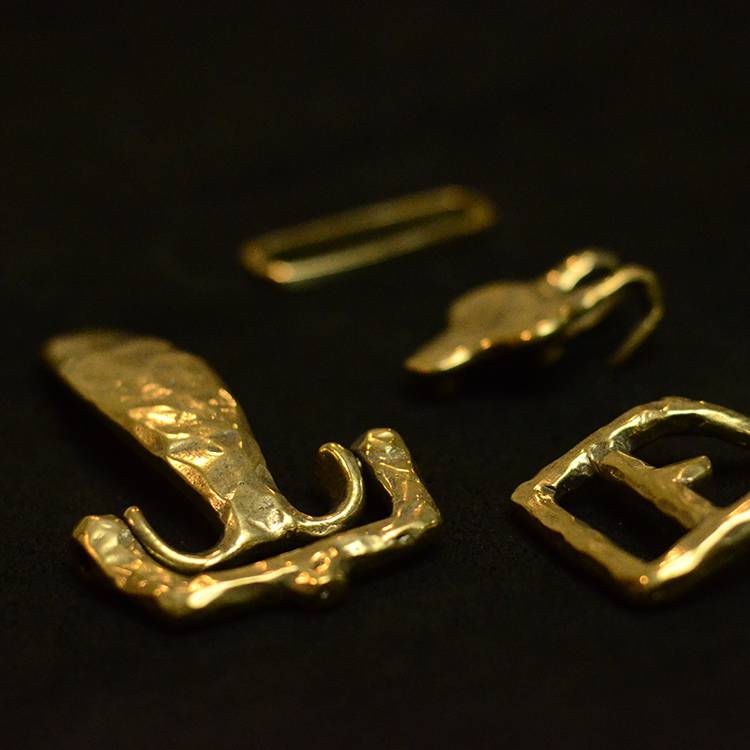 Bronze retrospect, hand-cut to make the cavalry head-button