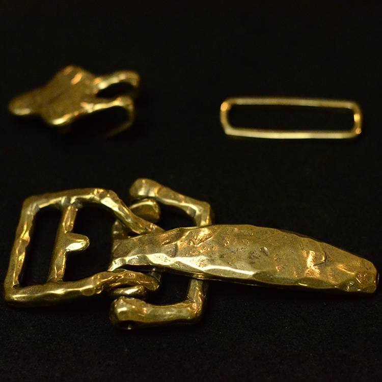 Bronze retrospect, hand-cut to make the cavalry head-button
