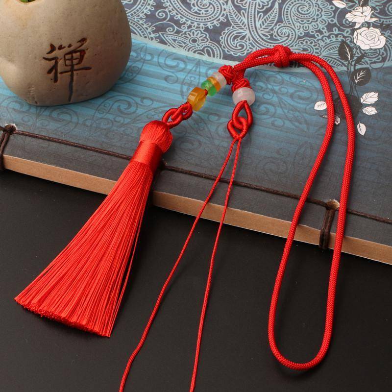 A red hand-held leash