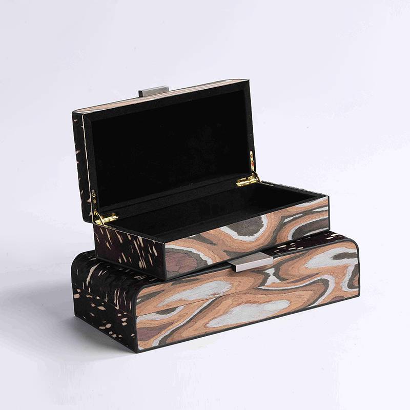 A metal leather tray in a bed-bed-head closet in a pony-skin-coated box box