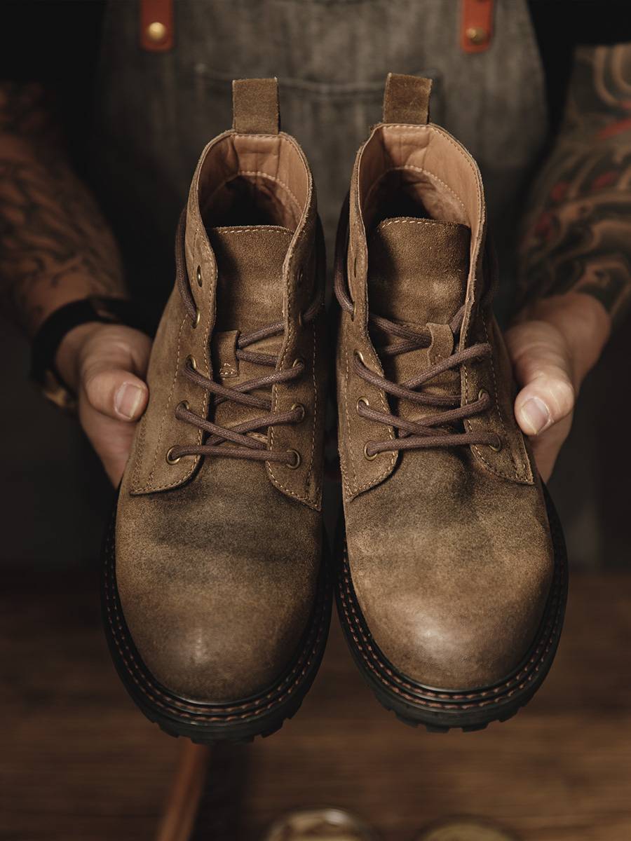 Martin's boot-shoes are scrawny with five holes in his outside shoes