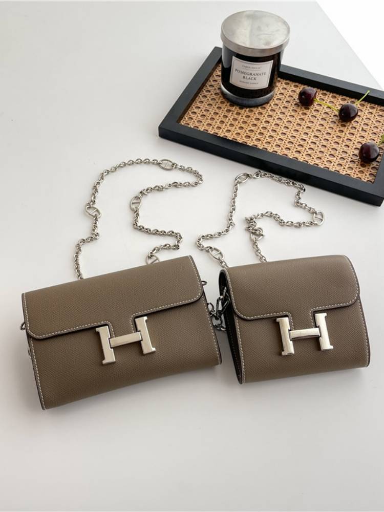 a new 2023 with a wallet swung across the purse