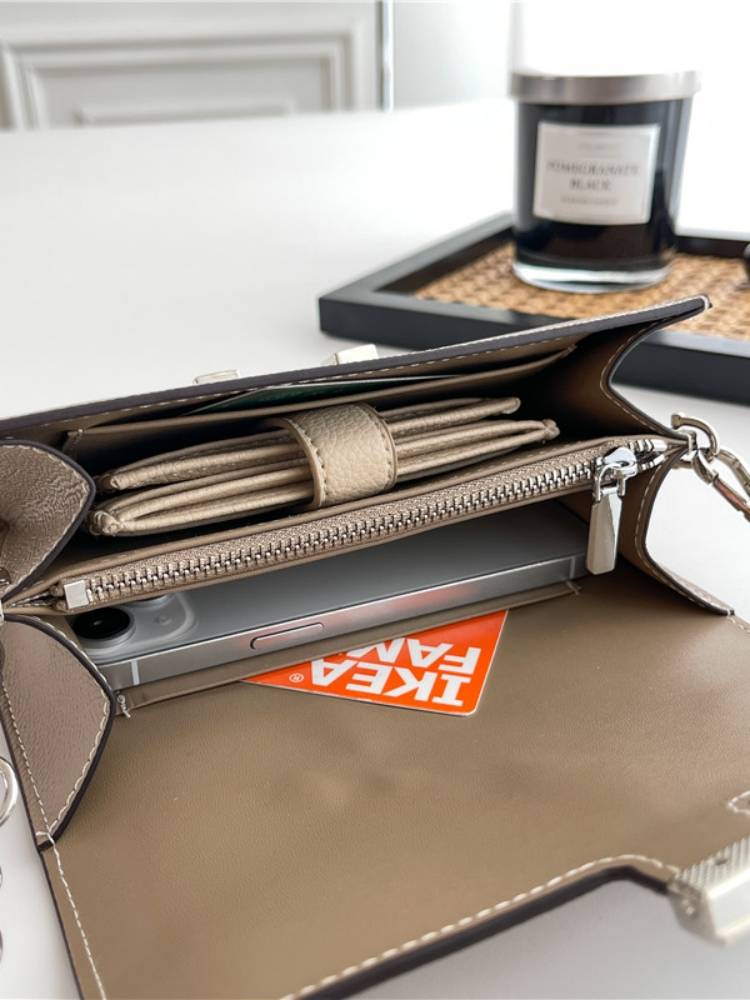 a new 2023 with a wallet swung across the purse