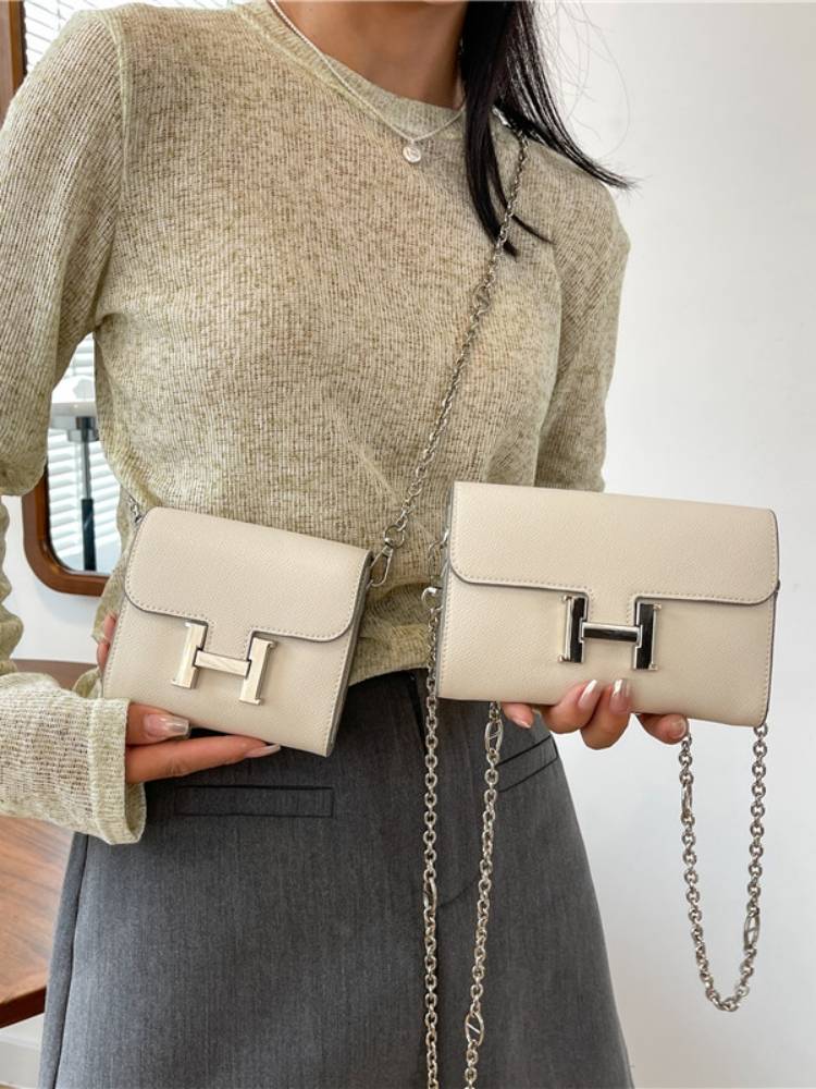 a new 2023 with a wallet swung across the purse