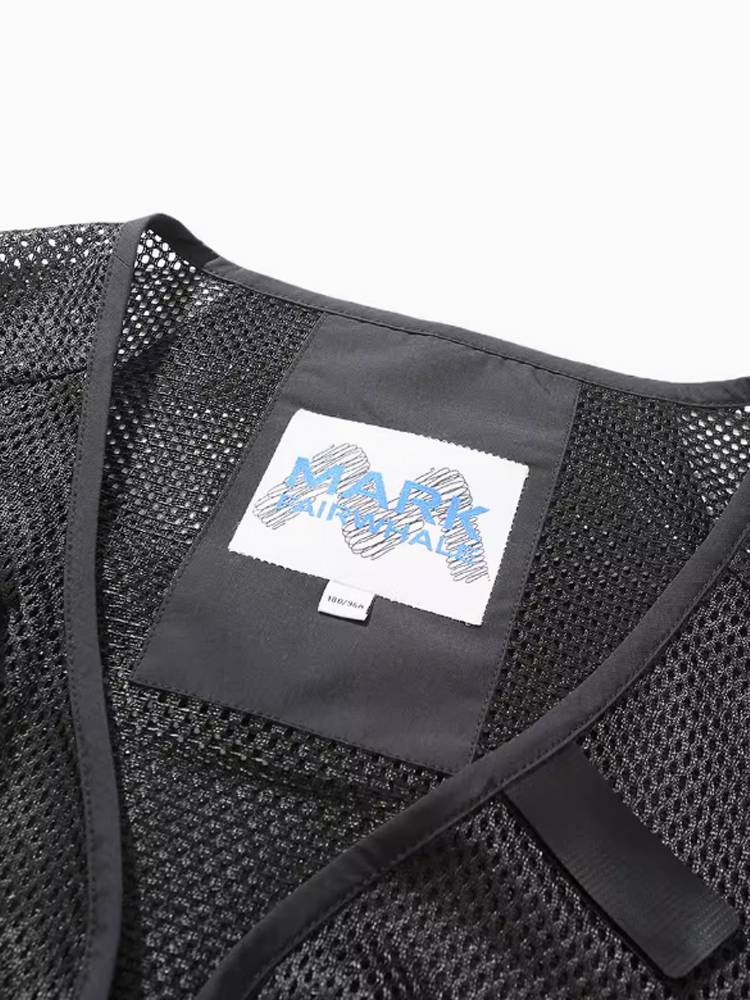 Mark Waffle Cube with a bag full of tweeds and tweeds and tweeds and jackets