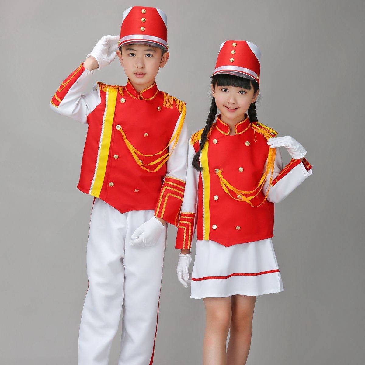 Drums costumed children performing a flag-raising ceremony for boys, girls, boys, boys, boys, boys