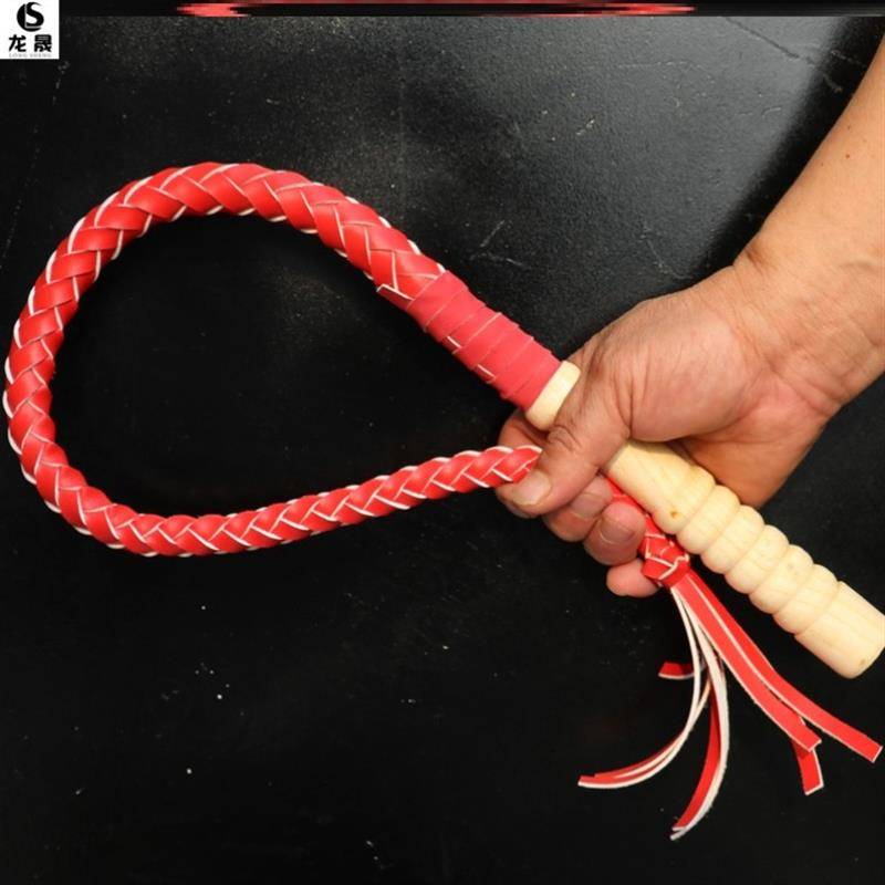 One metre of red, pure oxen whips and wooden handles