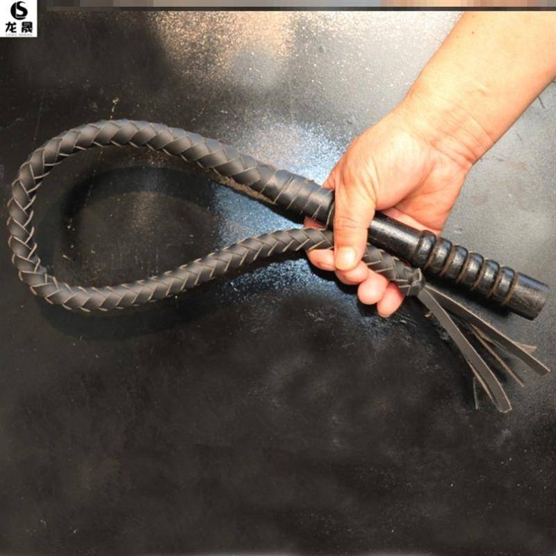 One metre of black, pure oxen lashes, wooden handle