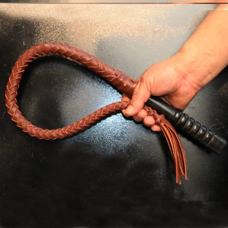 80 centimeters of brown, pure oxen-skin, wood handle