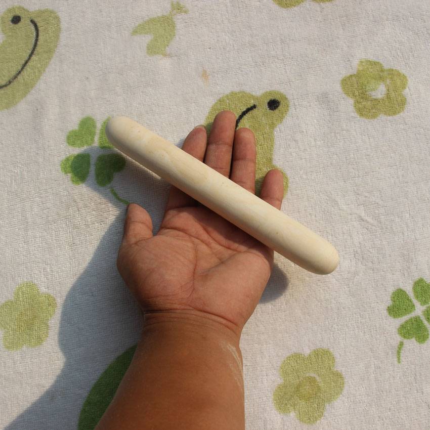 Cool Penning Hill White Wax Bar, a masseur's massage stick and a wooden stick