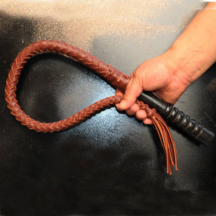 80 centimeters of brown, pure oxen-skin, wood handle