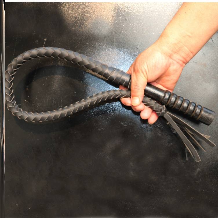 One metre of black, pure oxen lashes, wooden handle