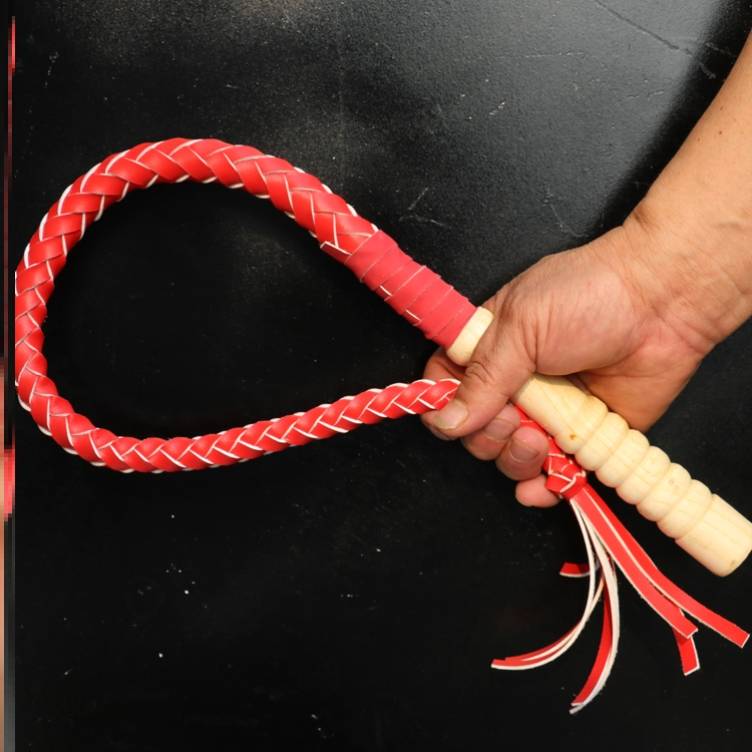 One metre of red, pure oxen whips and wooden handles