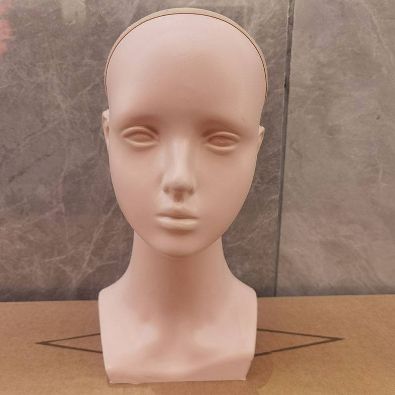 With a sewn little girl's head with no skin