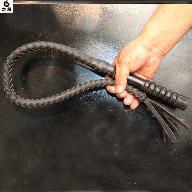 One metre of black, pure oxen lashes, wooden handle