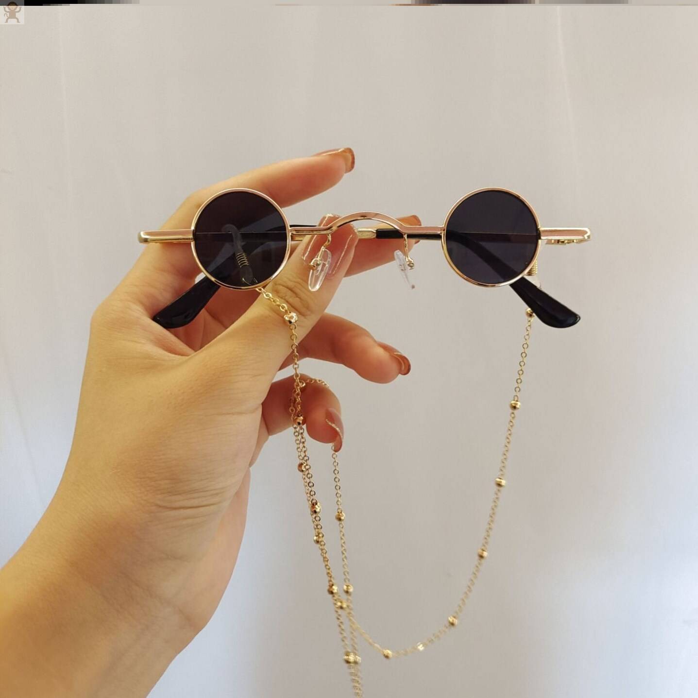 Golden frame black and gray single glasses