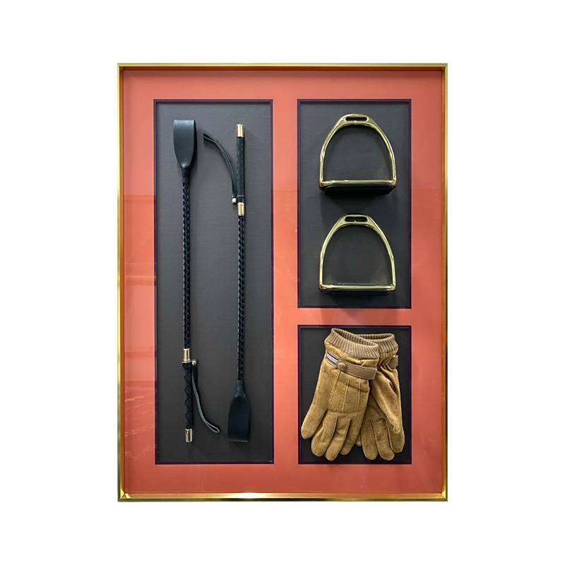 A LUXURIOUS LASHES COMBINATION OF ORANGE DECORATIVES AND A BACKGROUND WALL FOR THE LIVING ROOM IN THE M HOUSE OF THE MODEL ROOM