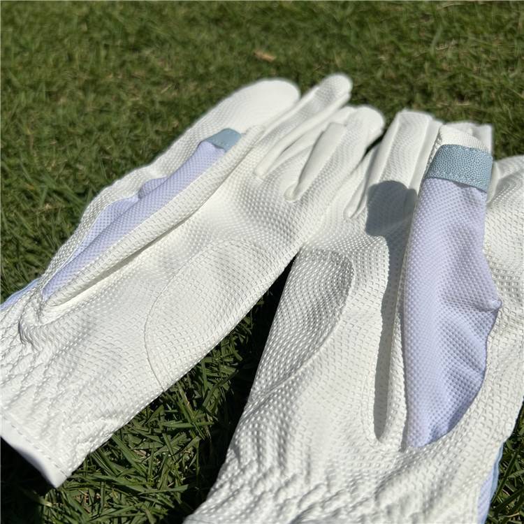 ms. golf gloves with her fingernails on her finger