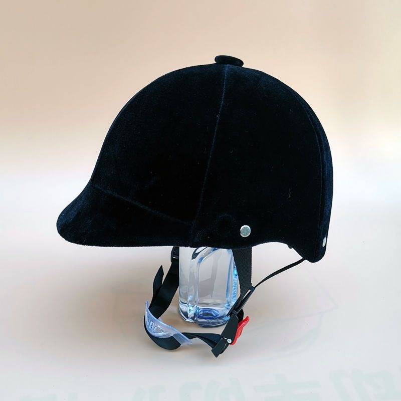 Young adults riding horse helmets, male and female horse hats, black equals