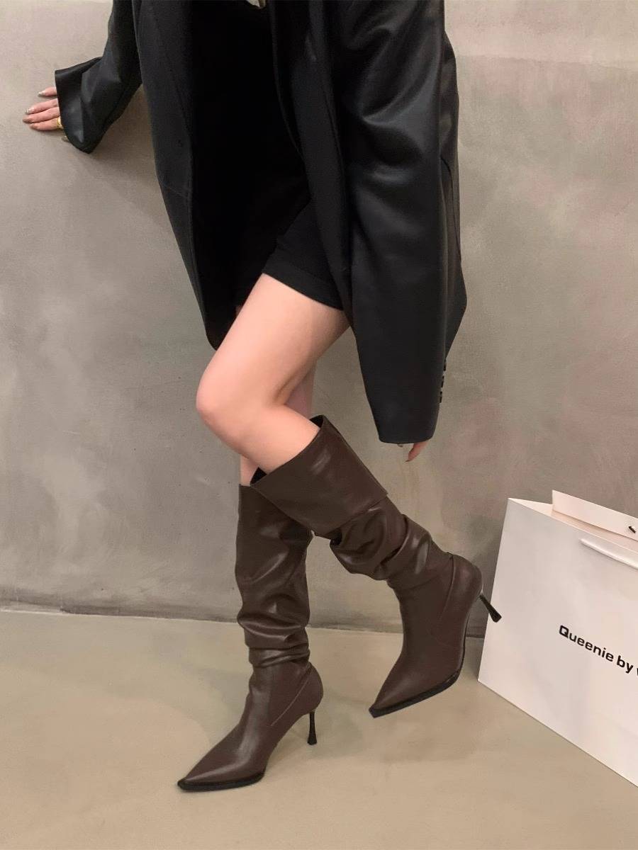 High-and-tip-heads piled up with long-cooled boots and fresh autumn winter shoes in 2023