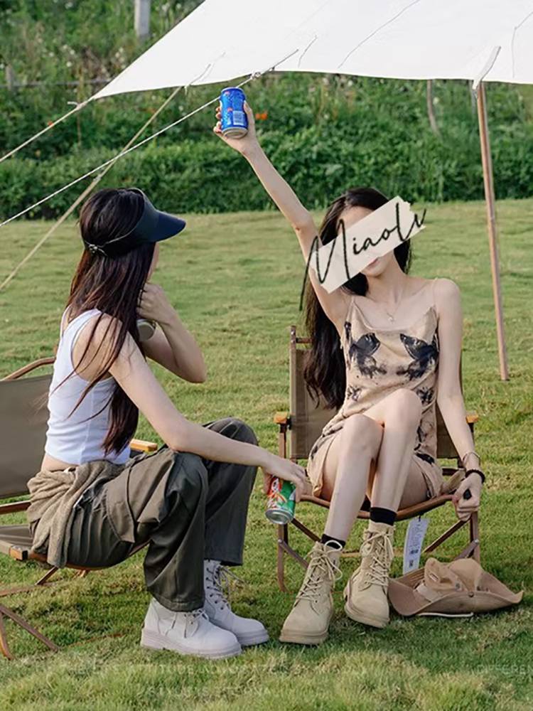 Hong Kong's Martin Boots Girl in Xinjiang Tibet travels on savannah shorts in the desert
